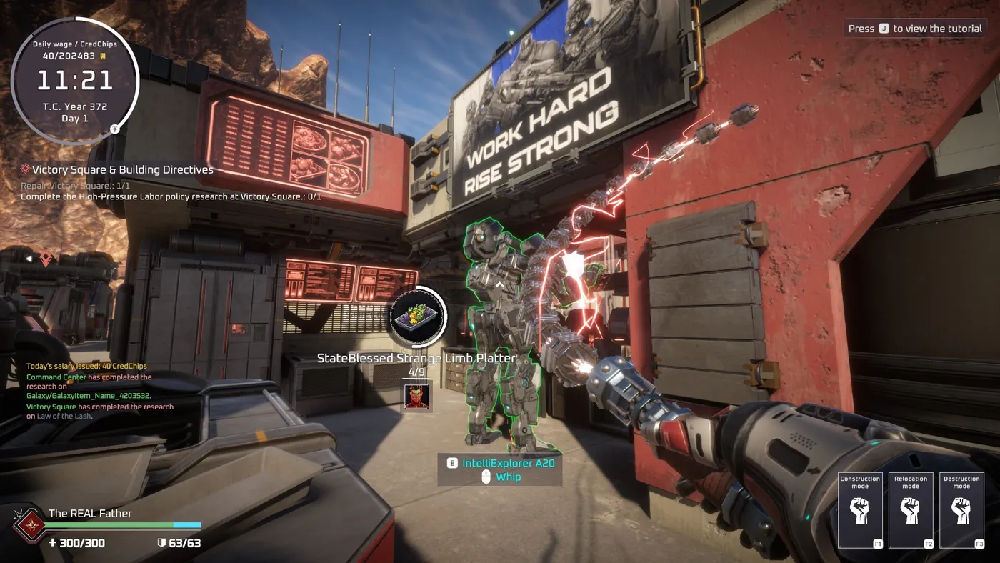 First-person view in Pax Autocratica showing a WORK HARD RISE STRONG propaganda billboard above a colony street, with a weapon raised and the daily wage and CredChips counters visible in the HUD.